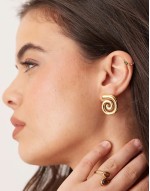 waterproof stainless steel stud earrings with swirl detail in gold tone