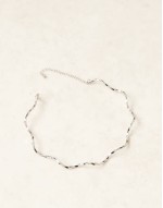 torque choker with wave design in silver tone